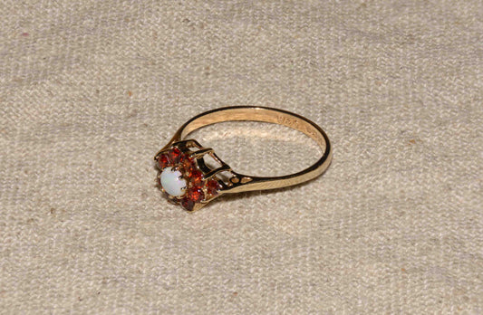 Garnet and opal yellow gold flower ring