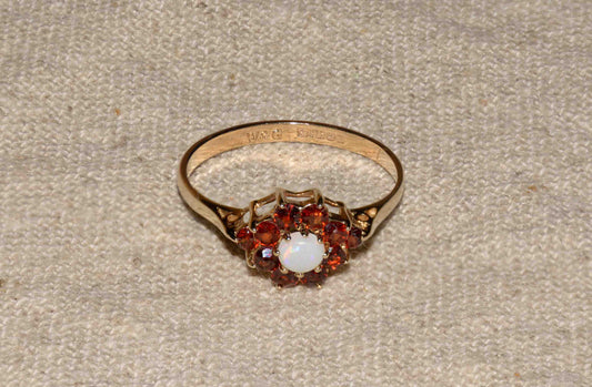 Garnet and opal yellow gold flower ring